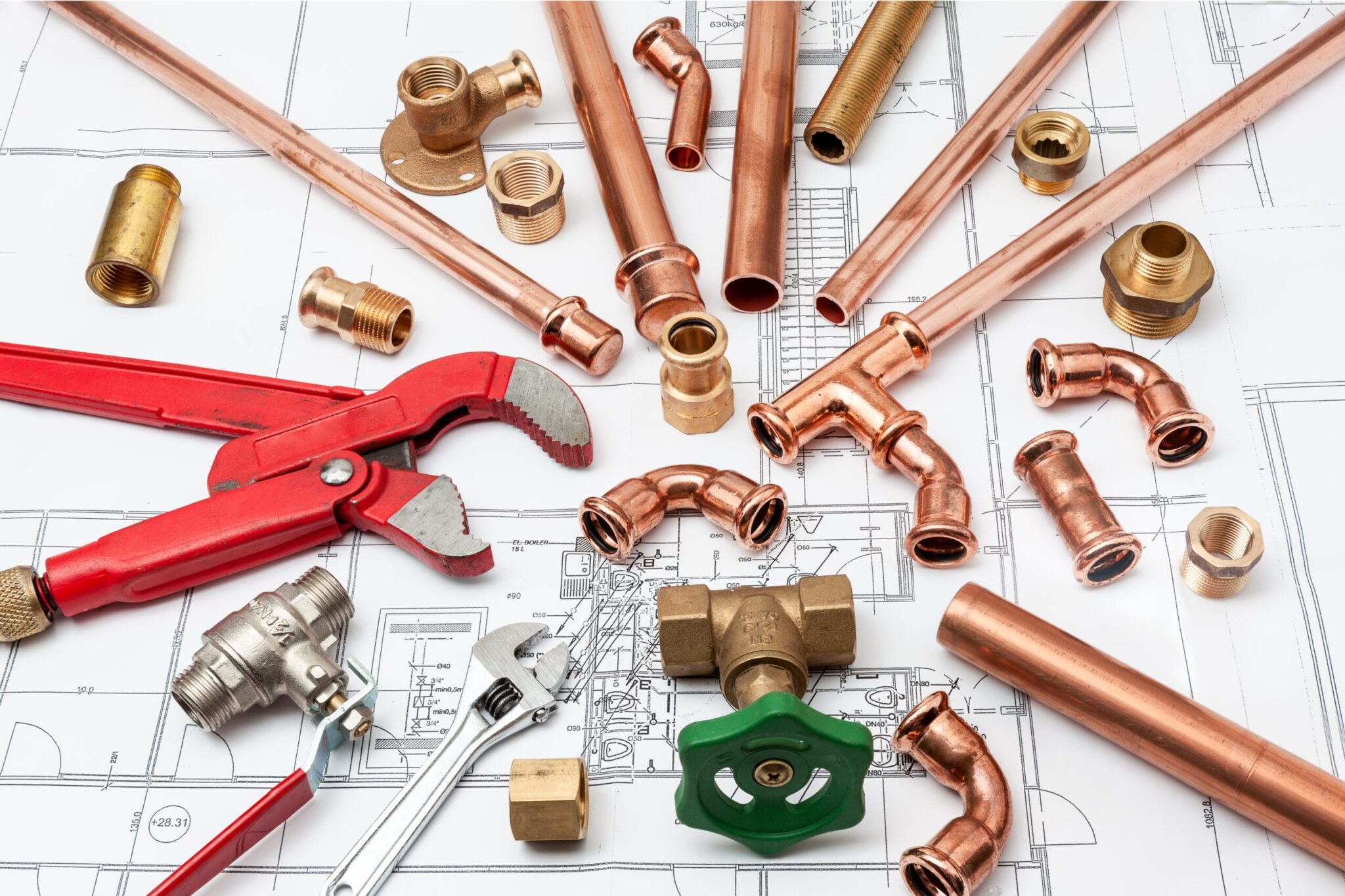 Copper pipes, fittings, valves, and plumbing tools in Aurora